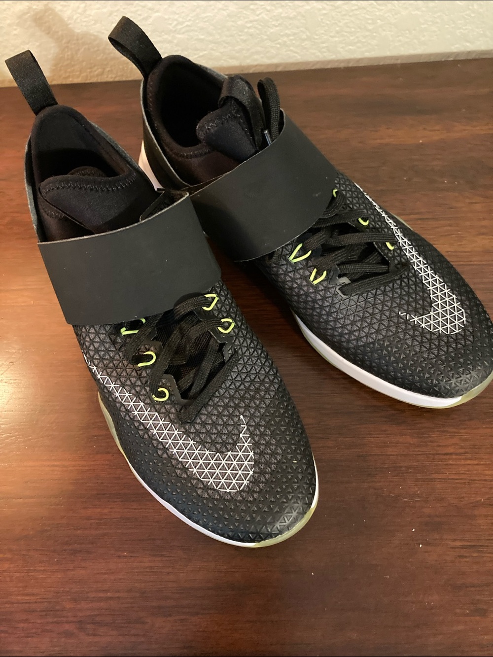 Nike women’s Black Athletic Shoes with White Swoosh and Lime Accents